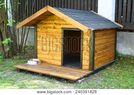New Wooden Dog House In The Garden