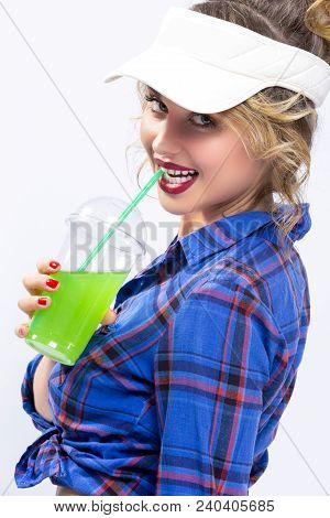 Youth Ideas And Concepts.closeup Of Enticing Caucasian Female In Checked Shirt Drinking Green Cockta