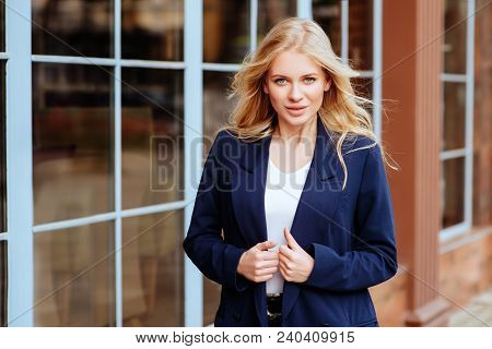Young Beautiful Girl In Stylish Siut In The City