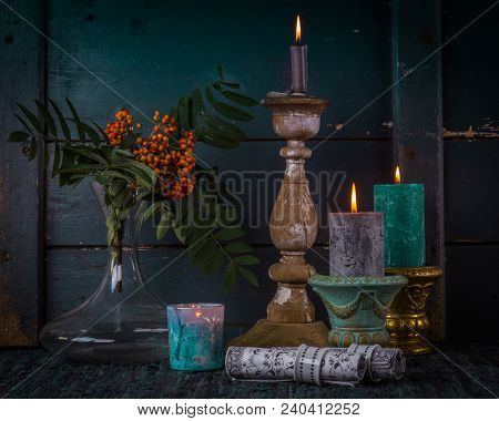 Rough Simple Still Life With Three Old Candlesticks And Branch Of Rowan, On The Dark Wooden Backgrou