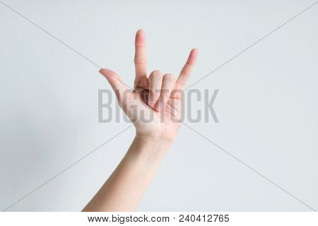 Hand Signs Showing Thumb, Forefinger And Little Finger, Up That Meaning I Love You On White Backgrou