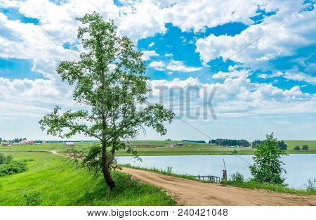 Pond And Trees Growing Along A Dam In Rural Areas In Udmurtia, In Russia