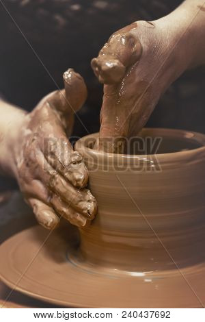 Pottery. The Master At The Potter's Wheel, Produces A Vessel Of Clay