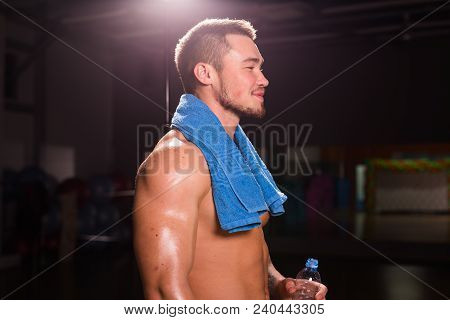 Mixed Race Man Is Working Out On Butterfly Machine In Gym.
