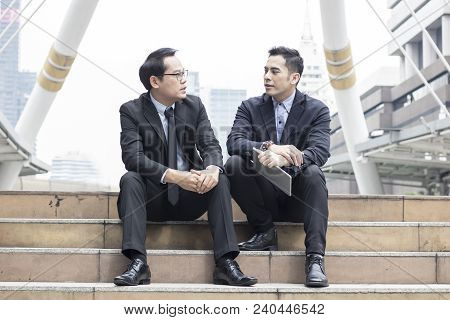 Two Business Talking With Partner About Business And Invetment  On Way To Office