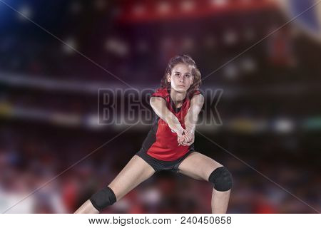 Female Professional Volleyball Player On Volleyball Court.