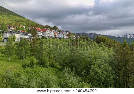North Norway, Houses At The Mountain Slope In Narvik On A Summer Day With Clouds