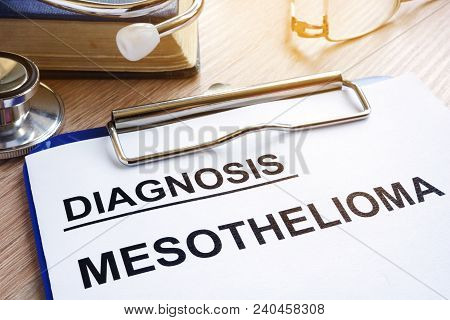 Diagnosis Mesothelioma And Stethoscope On A Desk.