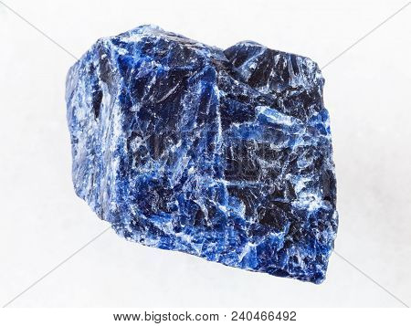 Macro Shooting Of Natural Rock Specimen - Rough Sodalite Stone On White Marble Background