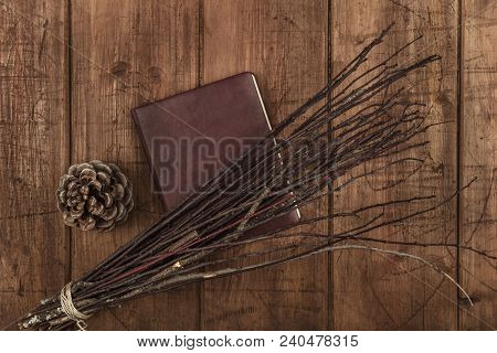 An Overhead Photo Of A Handmade Broom With A Book Of Shadows And A Pine Cone, Wicca Objects, With Co