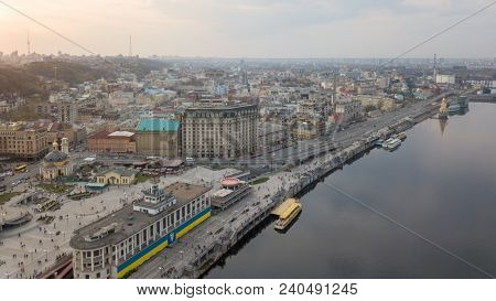 From the bird's eye view of the river station, Postal Square with St. Elijah Church , tourist boats in city Kiev
