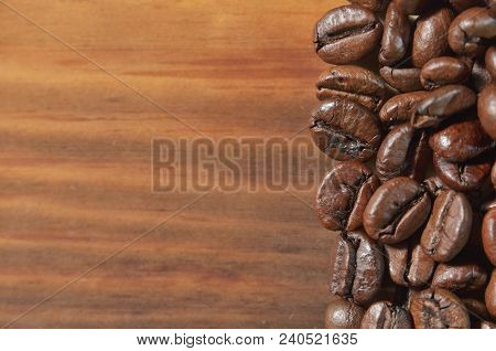 Selected Coffee Roasted Beans Are Lying On A Wooden Background. Texture, Wallpaper