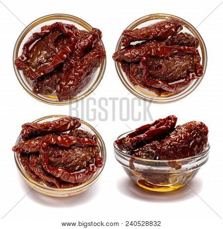 Set Of Canned Sundried Or Dried Tomato Halves In Glass Bowl On White Background