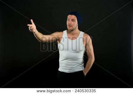 Man With Muscular Arms And Tight T Shirt Pointing With Index Finger. Masculinity Concept. Macho On W