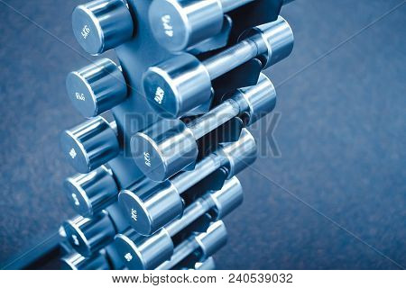 Rows Of Dumbbells In The Gym With Hign Contrast And Monochrome Color Tone