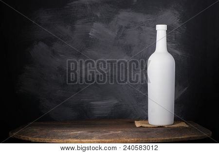 Wine Bottle Mock-up. Red Wine Bottle On Wooden Background