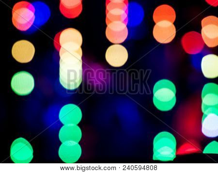 Abstract Pattern Of Colour Blurred Bokeh Neon Lights At Night Club