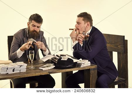 Company Engaged In Illegal Business. Men Sitting At Table With Piles Of Money And Typewriter. Illega