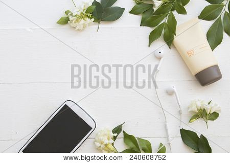 Natural Cosmetics For Skin Face Sunscreen Spf50 And Mobile Phone Of Lifestyle Woman Relax Summer