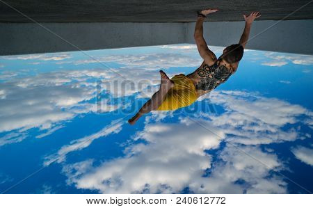 Tricking On Street. Martial Arts. Man Makes Leap With Support Of His Hands Barefoot. Shooted From Bo