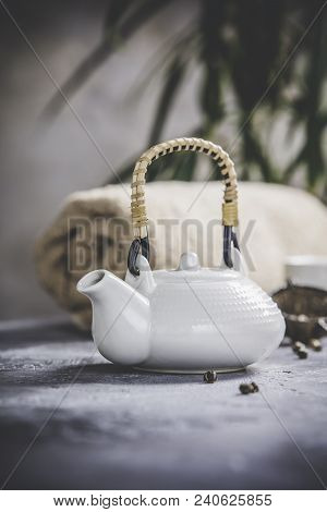 Tea Set And Spa Settings On Concrete Background. Natural Spa Treatment And Relaxation Concept