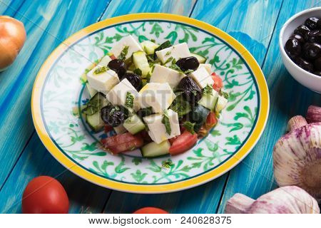 Greek salad with feta cheese cubes and fresk vegetables