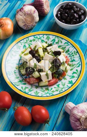 Greek salad with feta cheese cubes and fresk vegetables