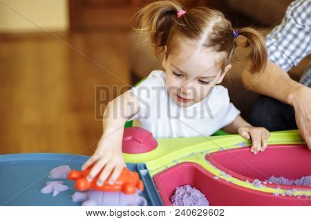 Little Girl Playing With Kinetic Sand At Home, Games, Education, Children.