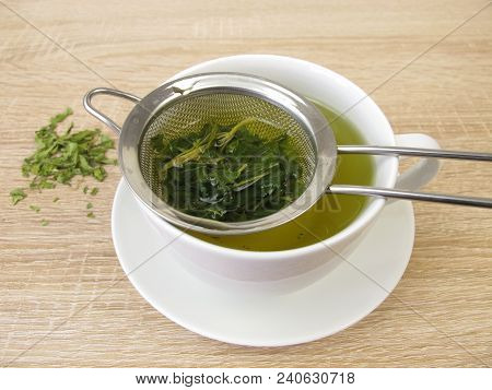 Freshly Brewed Tea From Edible Hemp In Tea Strainer