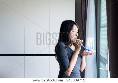 Patient Asian Woman Using Incentivespirometer Or Three Balls For Stimulate Lung