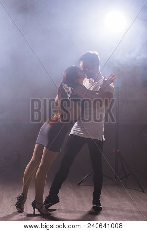 Young Couple Dancing Social Danse Kizomba Or Bachata Or Semba Or Taraxia In Dancing Class Background