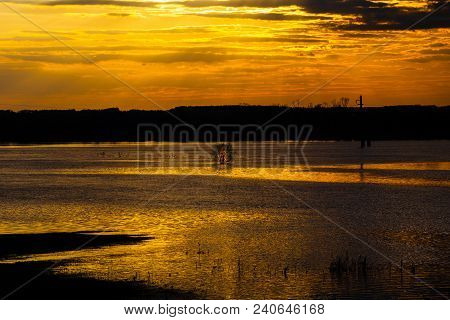 Beautiful Sunset On The River. Central Tree. Flood, High Water In Desna.
