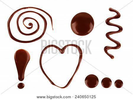 A Set Of Chocolate Drops Of Various Shapes With A White Background