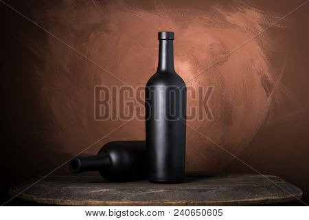 Red Wine Bottle On A Wooden Brown Background