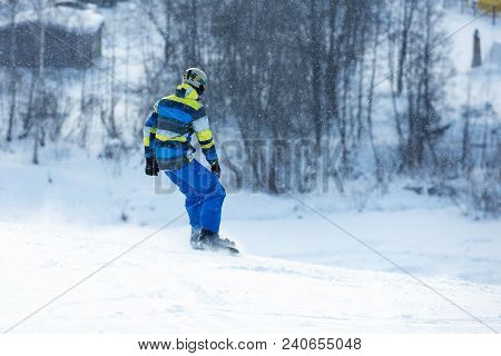 Men Go Skiing On Snow In The Mountains. Winter Nature. The Man Rides At Speed On Snow. Mountain For 