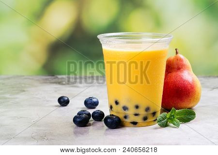 Homemade Mango And Pear Boba Bubble Tea With Tapioca Pearls On Summer Background. Copy Space