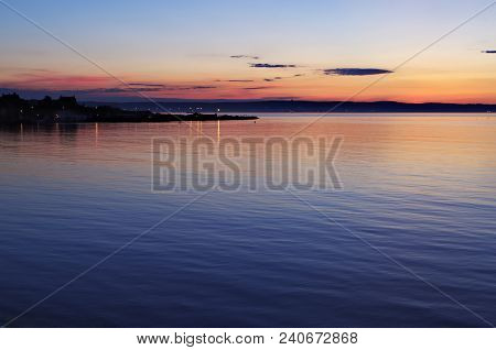 A sunset view of Ballyhomle beach near Bangor town.