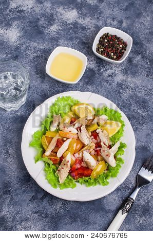 Fish Fillet With Raw Vegetables And Lemon In A Dish On The Table. Selective Focus.
