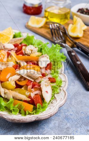 Fish Fillet With Raw Vegetables And Lemon In A Dish On The Table. Selective Focus.