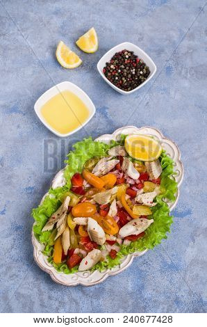 Fish Fillet With Raw Vegetables And Lemon In A Dish On The Table. Selective Focus.