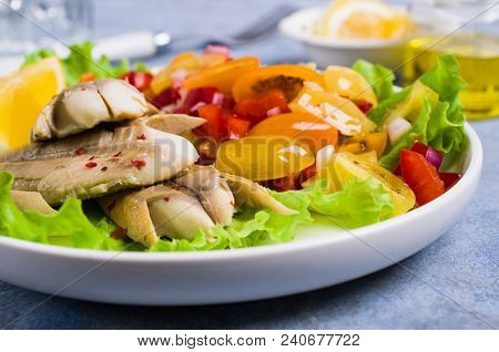 Fish Fillet With Raw Vegetables And Lemon In A Dish On The Table. Selective Focus.
