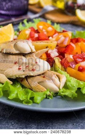 Fish Fillet With Raw Vegetables And Lemon In A Dish On The Table. Selective Focus.