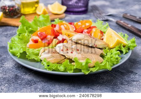 Fish Fillet With Raw Vegetables And Lemon In A Dish On The Table. Selective Focus.
