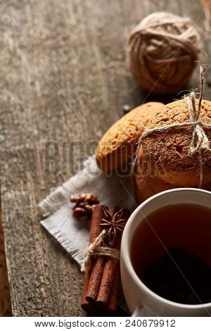 Traditional Christmas Tea Concept With A Cup Of Hot Tea, A Large Set Of Cookies On A Homespun Napkin