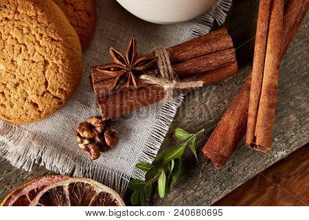 Traditional Christmas Tea Concept With A Large Set Of Cookies On A Homespun Napkin, Cinnamon Sticks 
