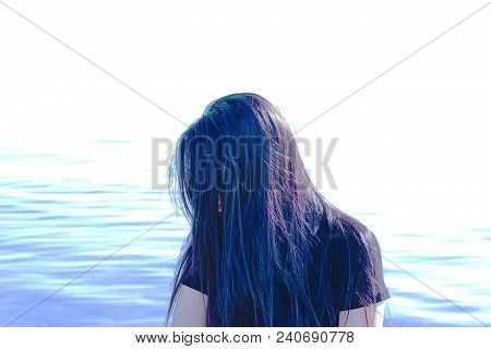 Happy Woman On The Beach. Portrait Of A Beautiful Girl Close-up. Spring Portrait On The Beach. Young