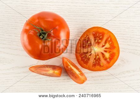 Red Tomato Collection Top View Isolated On Grey Wood Background One Whole One Section Half And Two S