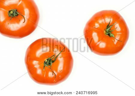 Three Red Tomato With Vine Ends Top View Isolated On White Background