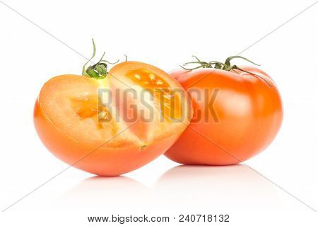 One Red Tomato And One Sliced Section Half Isolated On White Background
