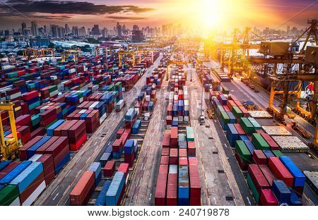 Logistics And Transportation Of Container Cargo Ship And Cargo Plane With Working Crane Bridge In Sh